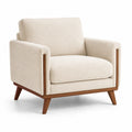 Fauteuil en tissu bouclé beige avec structure en bois massif